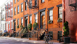 A street of row houses in a city.